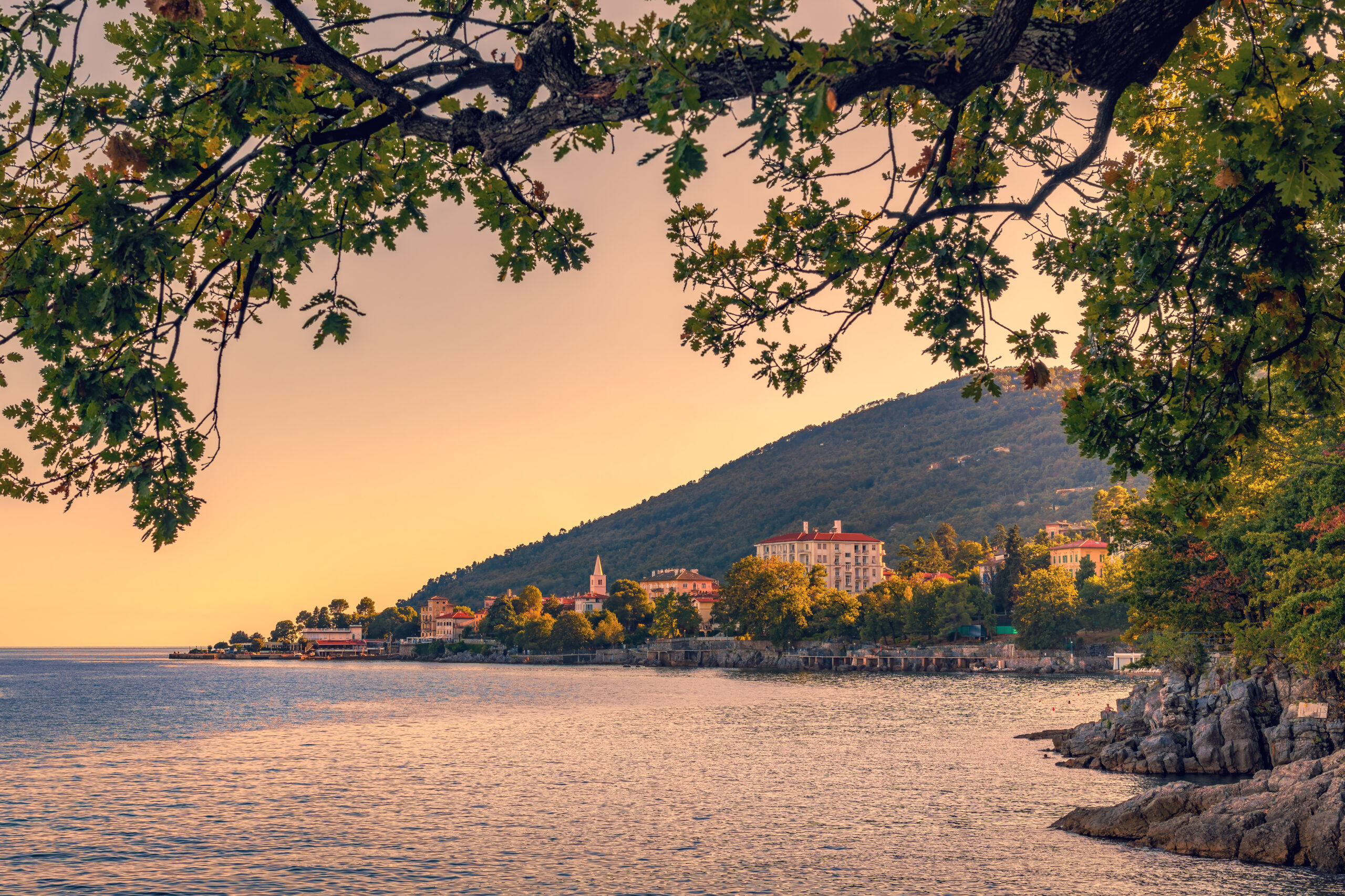 Lovran, famous travel destination town in Kvarner gulf of Adriatic sea in Croatia, in sunset. Selective focus.