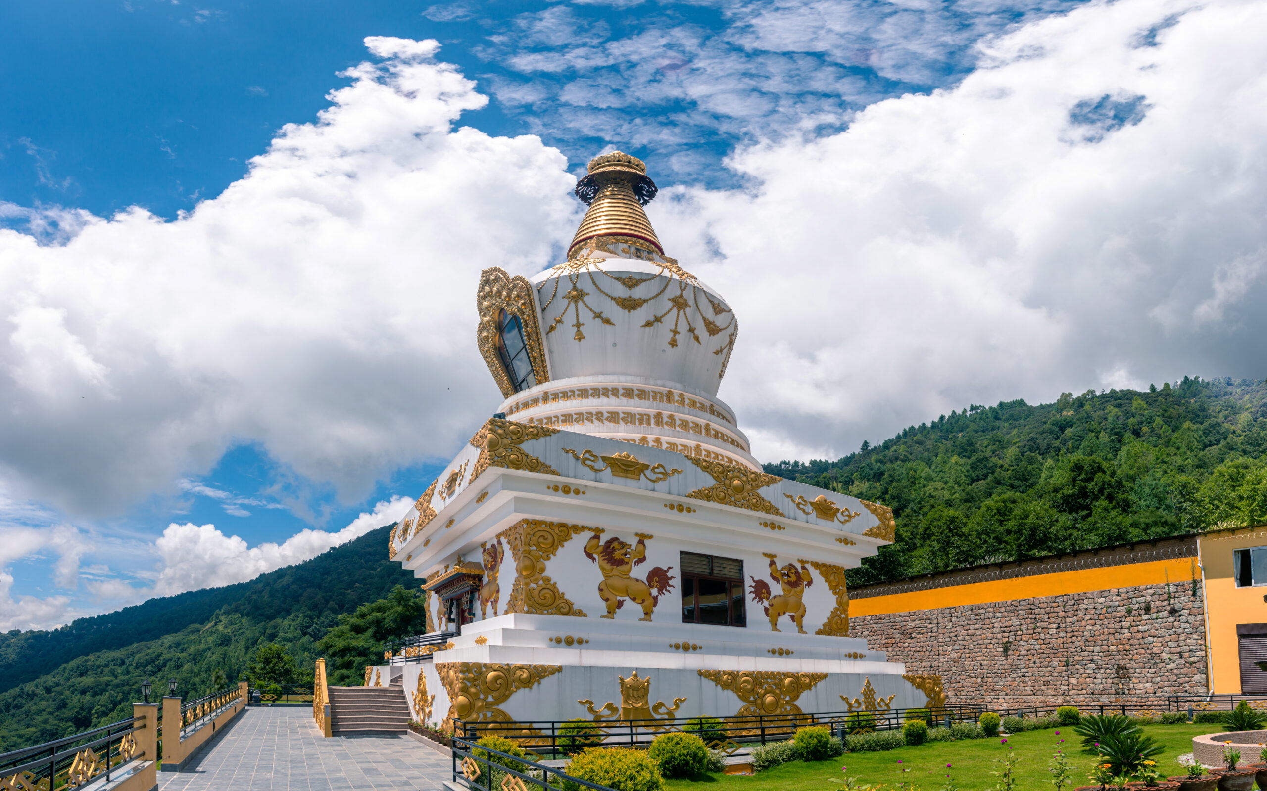 ornate-stupa-towering-with-golden-roof-and-lion-st-2026-03-24-12-57-22-utc